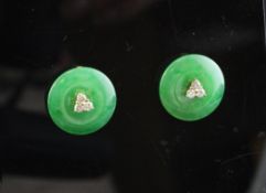 A pair of 18ct gold, jadeite and diamond set earrings, of disc form, with diamond cluster centre,