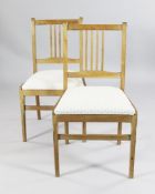 A set of six mid 20th century bleached walnut dining chairs, with patterned drop in seats on