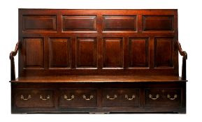 A GEORGE III OAK SETTLE, 2ND HALF 18TH CENTURY, the fielded panel back with shaped arms, the boarded