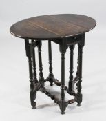 A small 18th century oak oval gateleg table, with single end drawer, on turned underframe,