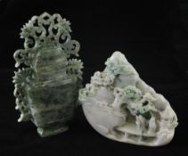 A Chinese jadeite vase and cover and a similar boulder carving, the vase carved in relief with