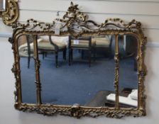 A 19th century carved giltwood wall mirror, acanthus scroll and ribbon openwork crest and a
