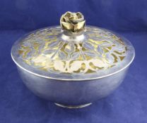 A 1960`s parcel gilt silver rose bowl and cover by Garrard & Co Ltd, of circular form, with