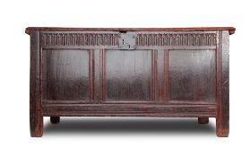 A CHARLES I PANELLED OAK COFFER, CIRCA 1650, the twin plank lid above a nulled frieze, 68cm x