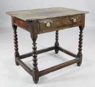 A 17th century oak side table, with single drawer, on bobbin turned legs united by stretchers, W.2ft