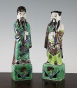 Two Chinese famille verte glazed biscuit figures of immortals, early 20th century, tallest 9.7in. (