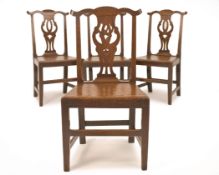 A SET OF FOUR GEORGE III OAK CHAIRS, MID 18TH CENTURY, with shaped and eared cresting rails above