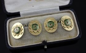 A cased pair of 18ct gold and enamel "Scot`s Guards" cufflinks, of oval form engraved and