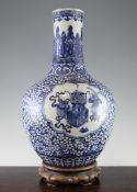 A large Chinese blue and white bottle vase, 19th century, painted with scholarly objects in ruyi