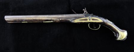 An 18th century flintlock pistol, with brass mounts and walnut stock, 20.5in. some repairs