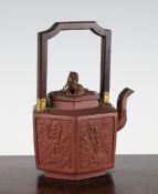 A Chinese Yixing hexagonal teapot and cover, late 17th / early 18th century, the body moulded with