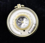 An early 20th century double sided pocket barometer, with opposing thermometer and compass dials,