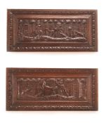 A PAIR OF FLEMISH CARVED OAK PANELS, MID 17TH CENTURY, the central panels within egg and dart