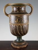 A large Martin Brothers Stoneware twin handled vase, c.1888, the part wrythen fluted body with