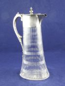 A late Victorian silver mounted cut glass claret jug, of panelled oval tapering form, with turned