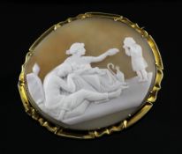 A late Victorian gold mounted oval cameo brooch, carved with classical figures, 2.25in.
