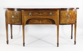 A 19th century inlaid mahogany breakfront sideboard, with central frieze drawer, a bow shaped