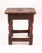 A CHARLES II SQUARE OAK JOINED STOOL, CIRCA 1660, the top probably associated, on square and