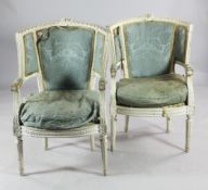 A pair of Louis XVI style white painted tub shaped open armchairs, with upholstered backs and seats,