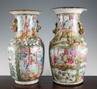 Two Chinese Canton decorated famille rose vases, late 19th century, each typically painted with
