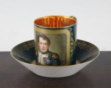 A Sevres style `Napoleon` coffee can and saucer, late 19th century, the can painted with a half