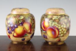 A pair of Royal Worcester fruit painted jars and covers, by Freeman & H.Ayrton, black printed