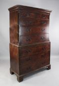 A George III mahogany chest on chest, with two short and three long drawers between reeded canted