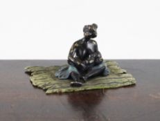 An Austrian cold painted bronze group of a black woman feeding her child, 3in.