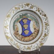 A Chinese export famille rose soup plate, c.1735, painted with the arms of Clarke, within fruiting