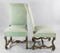 A set of four Louis XIV upholstered high back chairs, with gilt painted scroll carved supports and