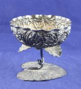 An Indian silver pedestal rose water bowl, with embossed foliate and berry decoration, on stalk stem