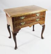 A late 18th century mahogany lowboy, fitted two drawers, on cabriole legs and pointed pad feet, W.
