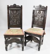 A pair of 18th century oak back stools, with floral carved panel back and crescent shaped foot rail