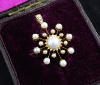 An Edwardian gold and split pearl set starburst pendant brooch, in original Wilson & Sharp of