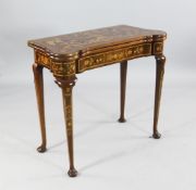 A 19th century Dutch marquetry inlaid folding card table, with baize lined interior, counter wells