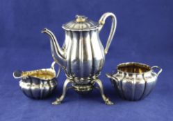 A George IV silver part tea & coffee set, housed in a brass handled mahogany carrying case A