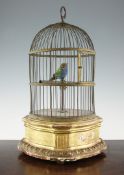 A late 19th century singing bird automaton, 20in. A late 19th century singing bird automaton, within