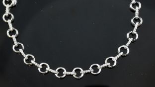 A 9ct white gold and diamond set articulated chain link bracelet, 7.25in. A 9ct white gold and