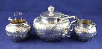 A late 19 Chinese Export silver three-piece tea service A late 19th/early 20th century Chinese