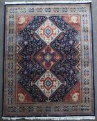 A Shirvan style carpet, 9ft 11in by 8ft 3in. A Shirvan style carpet, with three diamond motifs