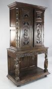 A 19th century Flemish carved oak cabinet on stand, H.6ft 3in. A 19th century Flemish carved oak