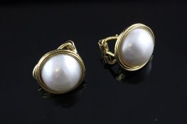 A pair of 18ct gold and mabe pearl earrings. A pair of 18ct gold and mabe pearl earrings.