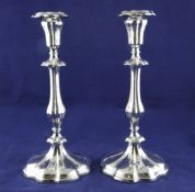 A pair of Victorian silver candlesticks, weighted. A pair of Victorian silver candlesticks, with
