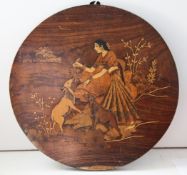 An Indian circular rosewood and marquetry panel, inlaid with girl and goats