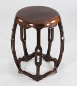 A Chinese rosewood circular garden seat, H.1ft 6in. A Chinese rosewood circular garden seat,