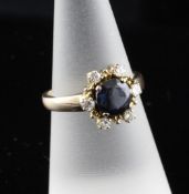 A 14ct gold, sapphire and diamond cluster ring, size M. A 14ct gold, sapphire and diamond cluster