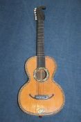 A 19th century Continental romantic parlour guitar, 38in. A 19th century Continental romantic