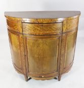 A Sheraton revival satinwood demi lune side cabinet A Sheraton revival satinwood demi lune side