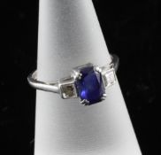 A 1940`s white gold and platinum three stone sapphire and diamond dress ring, Size L. A 1940`s white