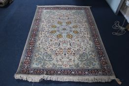 An Indian silk rug, 6ft 3in by 4ft. An Indian silk rug, with central foliate motif in a field of